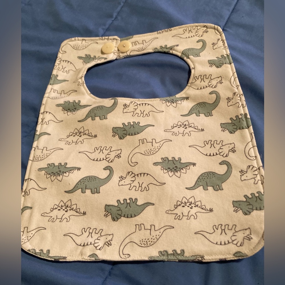 Reversible dinosaur baby bib